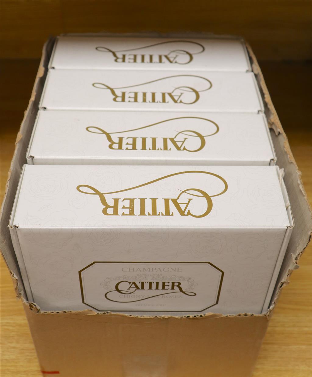A carton of four individual presentation boxes containing a half bottle of Cattier Champagne with two champagne glasses